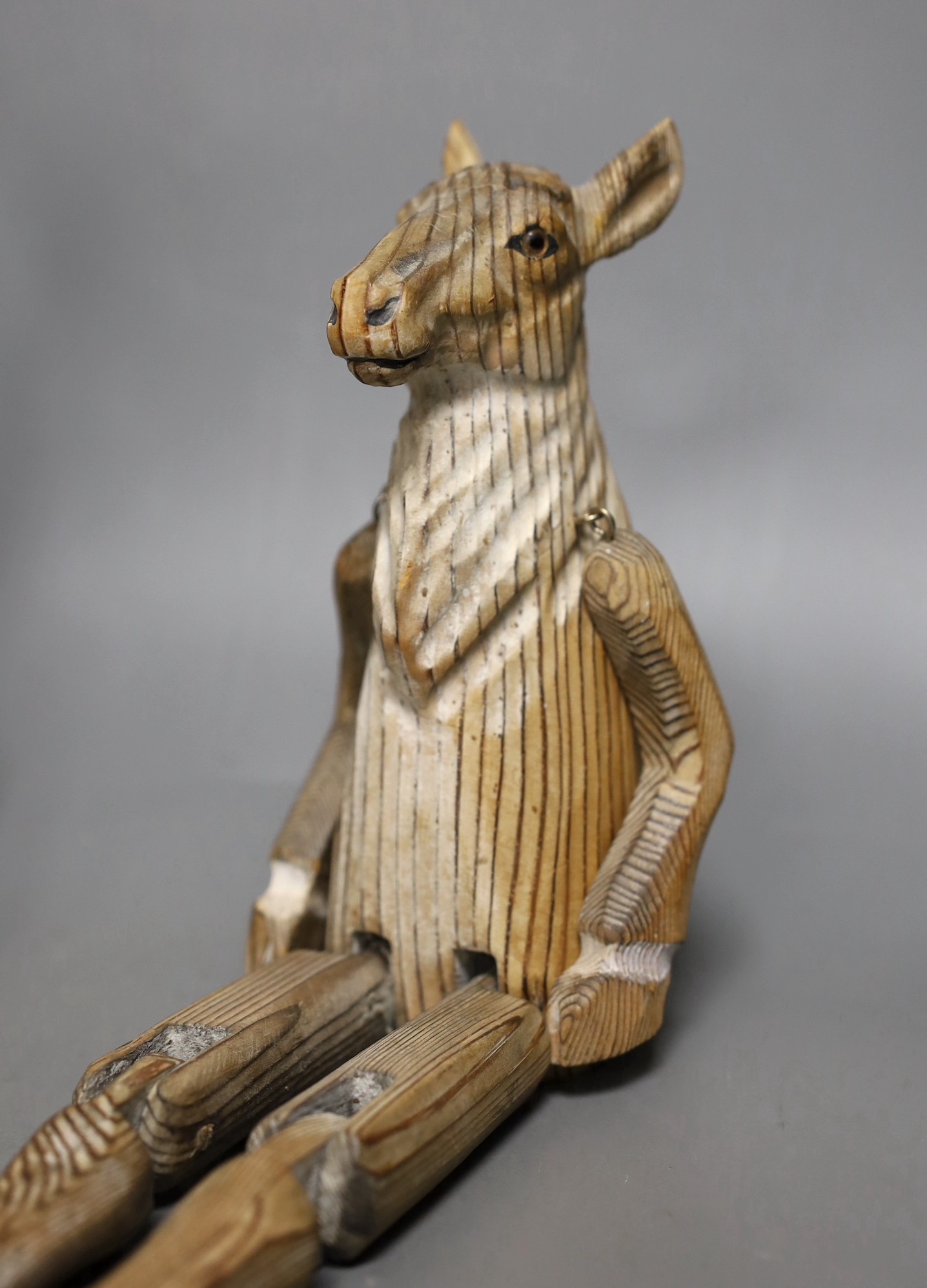 A pair of carved wood animal peg dolls, a hare and a sheep, hare tallest, 43cms high